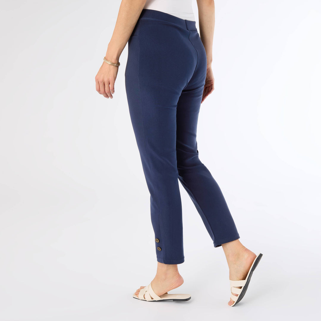 Navy blue pants worn by a person on a white background