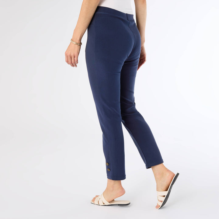 Navy blue pants worn by a person on a white background