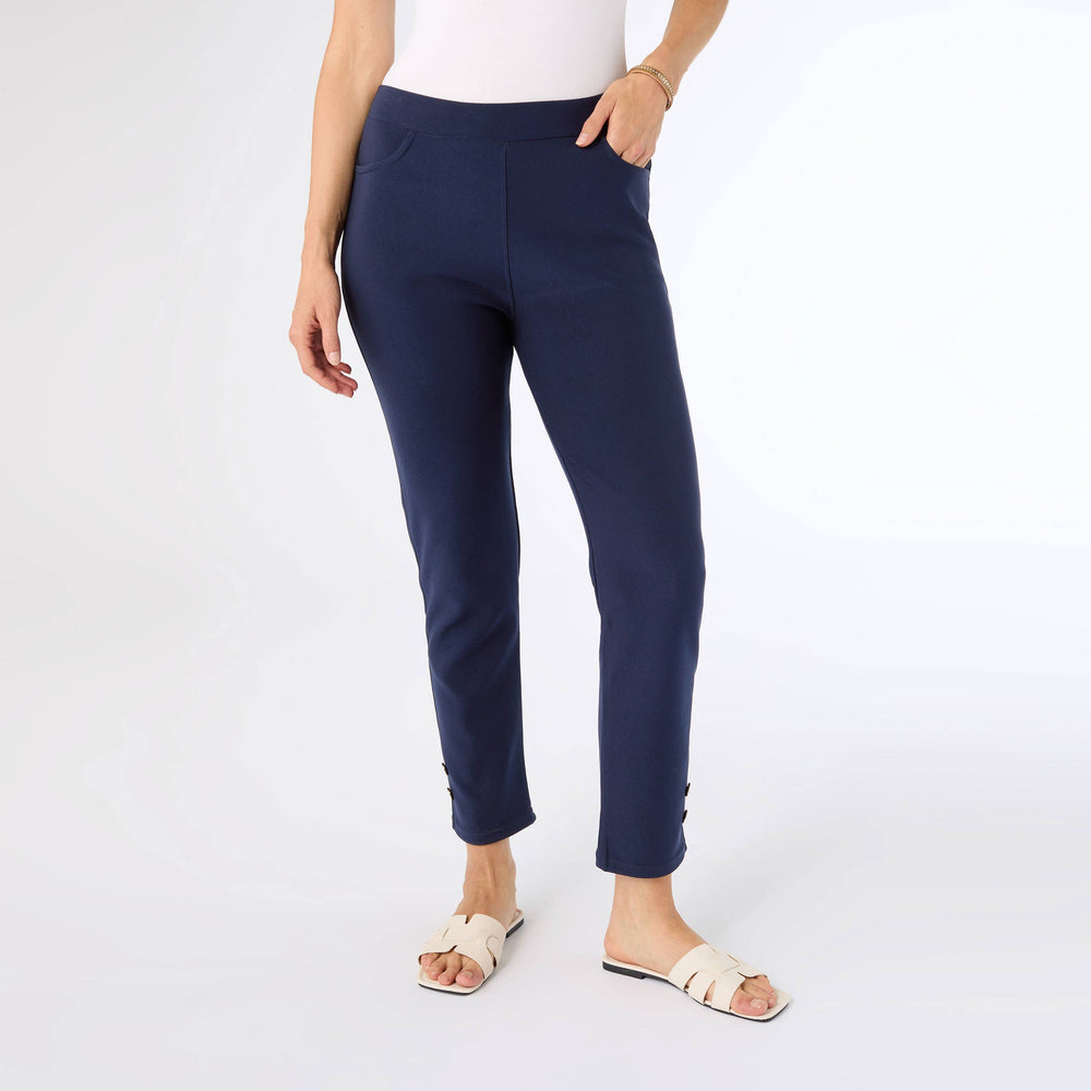 Person wearing navy blue pants on a white background