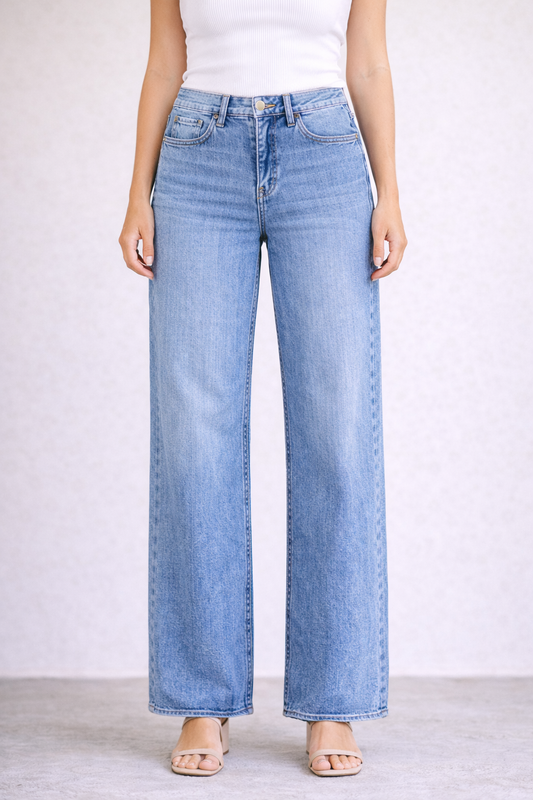 Light blue jeans worn by a person on a plain background