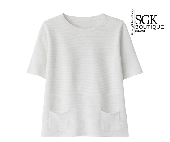 White sweater with a pocket on a white background, featuring the SGK Boutique logo.