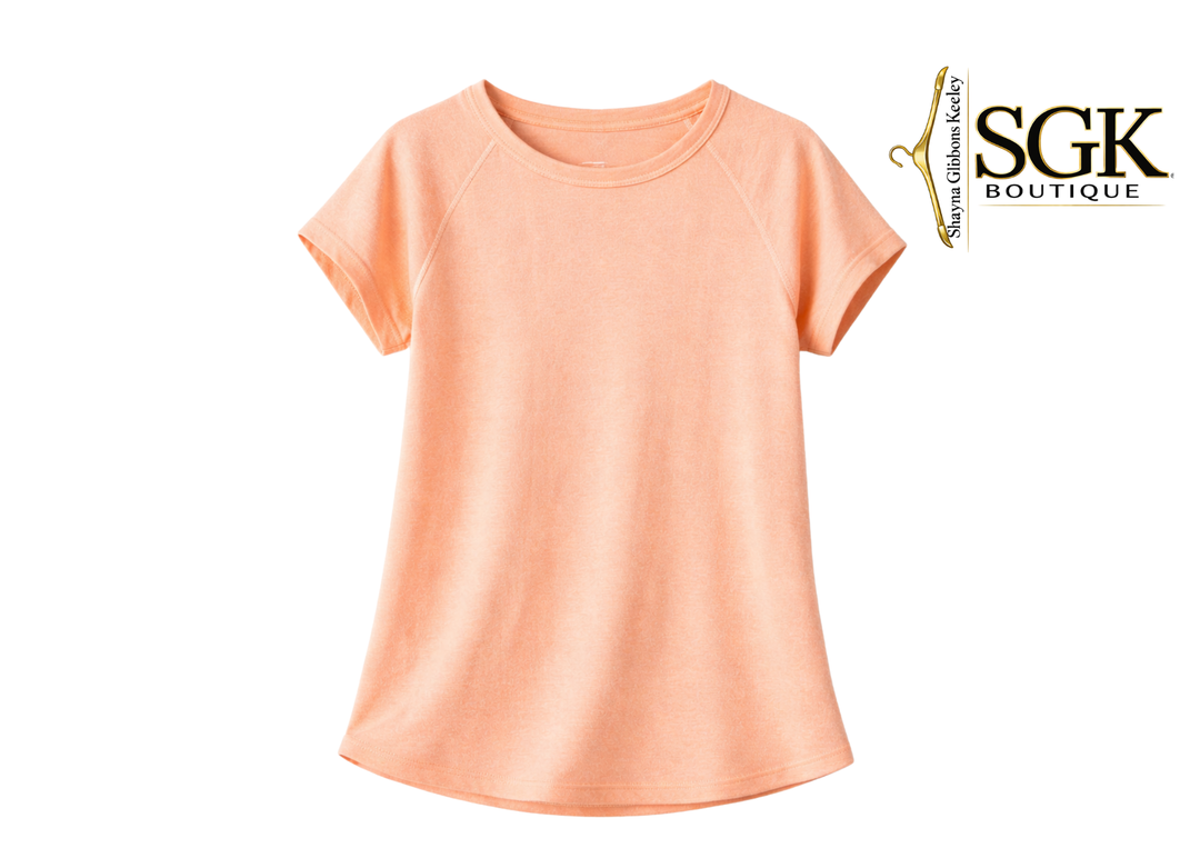 Peach-colored t-shirt on a white background with SGK Boutique logo.