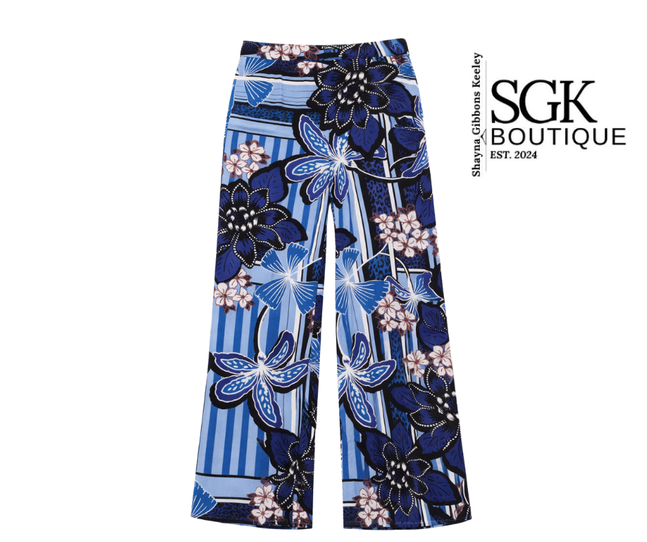 Floral-patterned pants with blue and black design on a white background, featuring SGK Boutique branding.