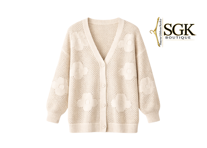 Beige cardigan with a textured pattern on a white background, featuring the SGK Boutique logo.