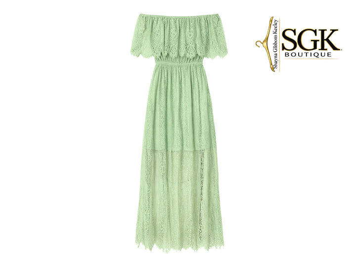 Green lace dress on a white background with SGK Boutique logo.