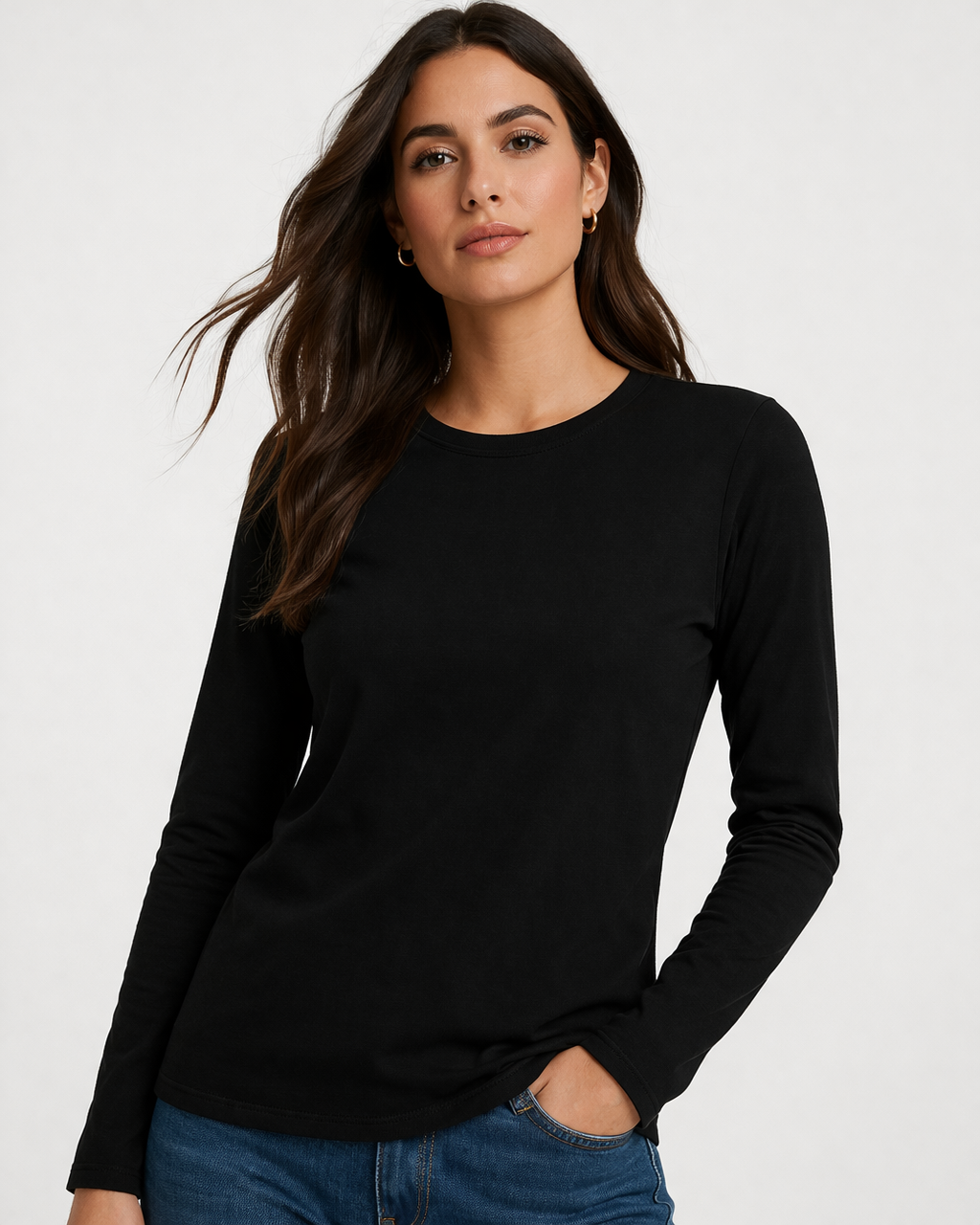 Woman wearing a black long-sleeve top against a white background