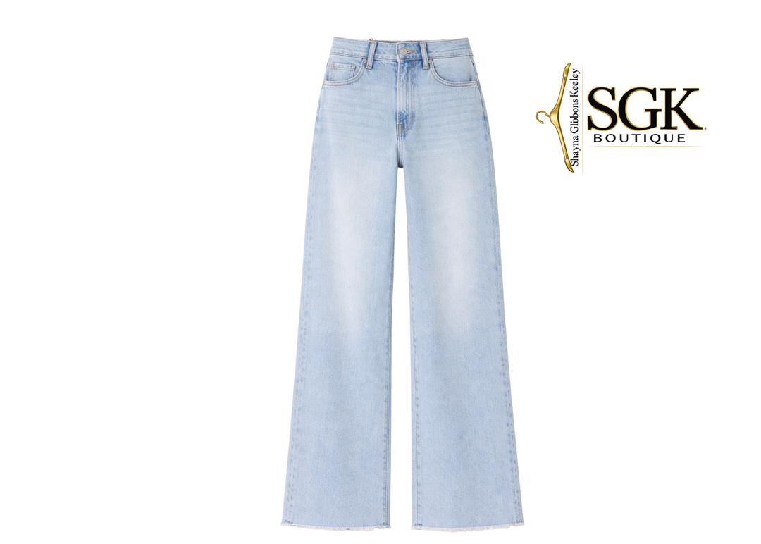 Light blue jeans on a white background with SGK Boutique logo.