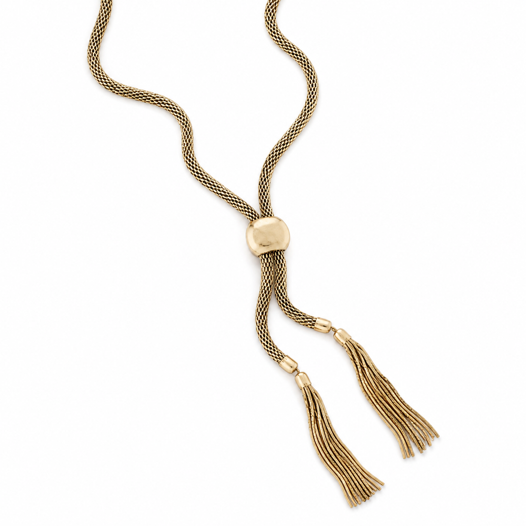 Gold necklace with tassels on a white background