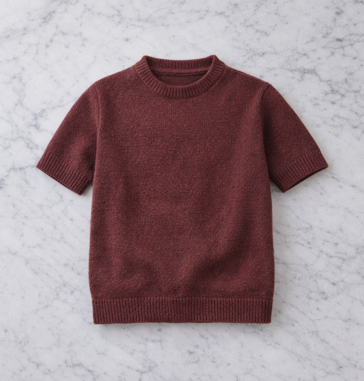 Brown sweater on a marble surface