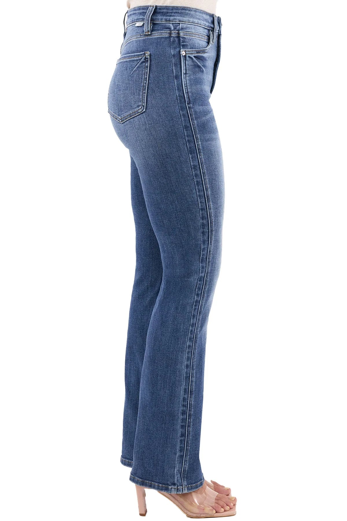 Blue jeans worn by a person on a white background