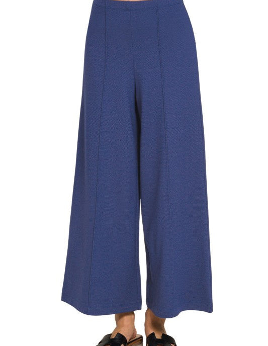 Navy blue wide-leg pants on a white background