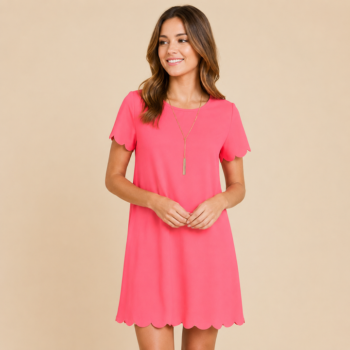 Woman wearing a pink dress against a beige background
