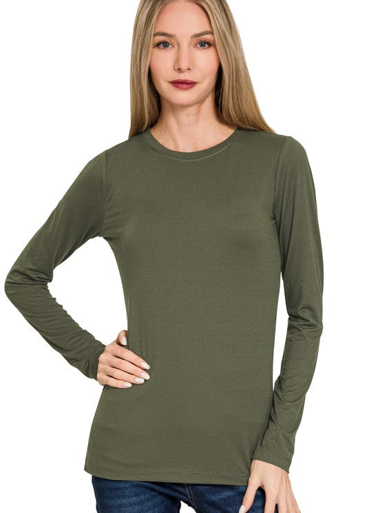 Woman wearing a green long-sleeve shirt on a white background