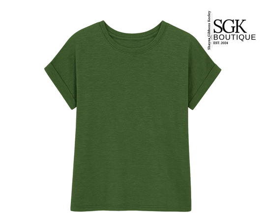 Green t-shirt on a white background with SGK Boutique logo.