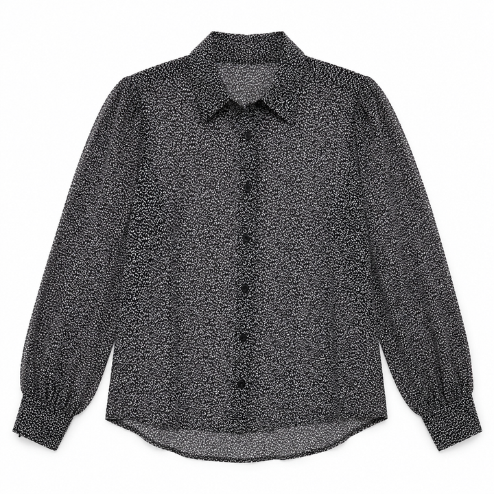 A long-sleeve button-up blouse with a textured, speckled black and white pattern, featuring a pointed collar and gathered cuffs, shown flat on a white background.
