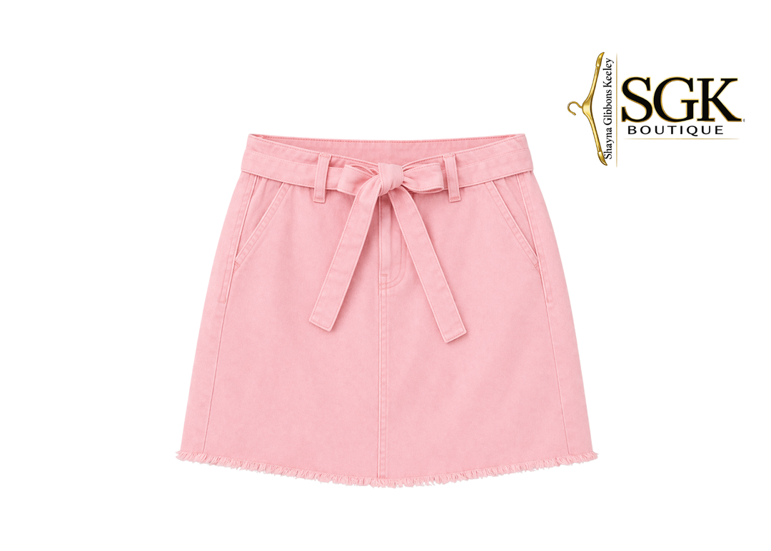 Pink skirt with a tie waist on a white background, featuring the SGK Boutique logo.