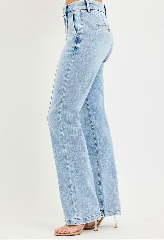 Light blue jeans worn by a person on a white background