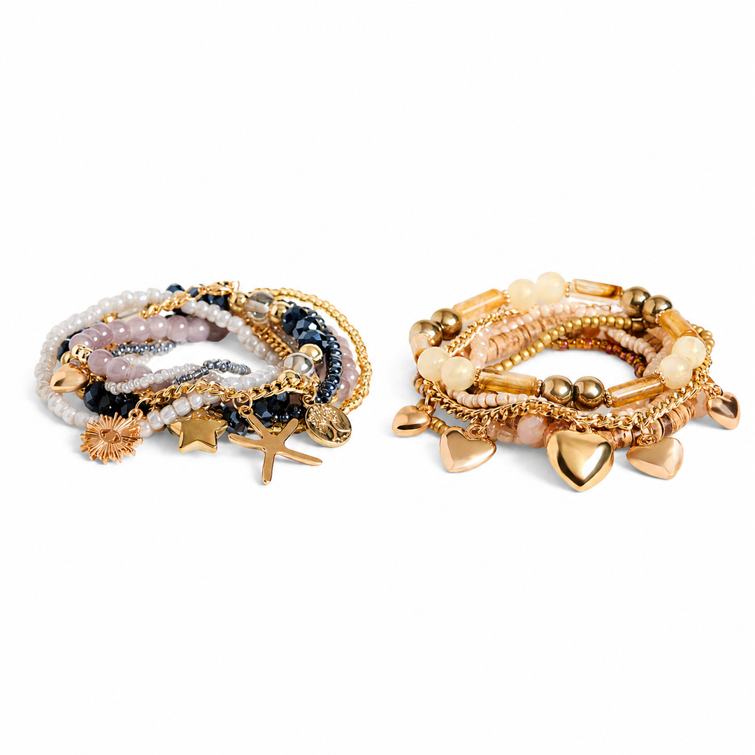Two sets of gold bracelets with various charms on a white background
