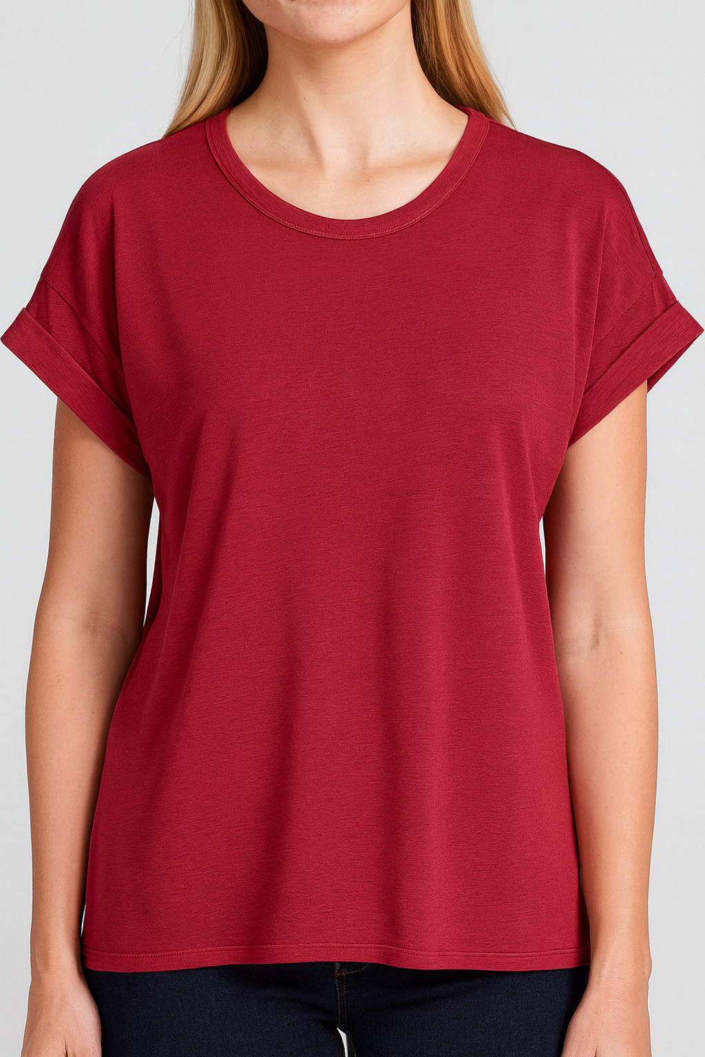 Red t-shirt worn by a person on a white background