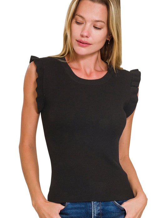 Woman wearing a black sleeveless top with ruffled shoulders on a white background