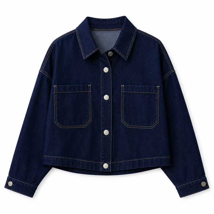 A dark blue denim jacket with a pointed collar, silver-tone snap buttons, and two front patch pockets, shown flat on a white background.