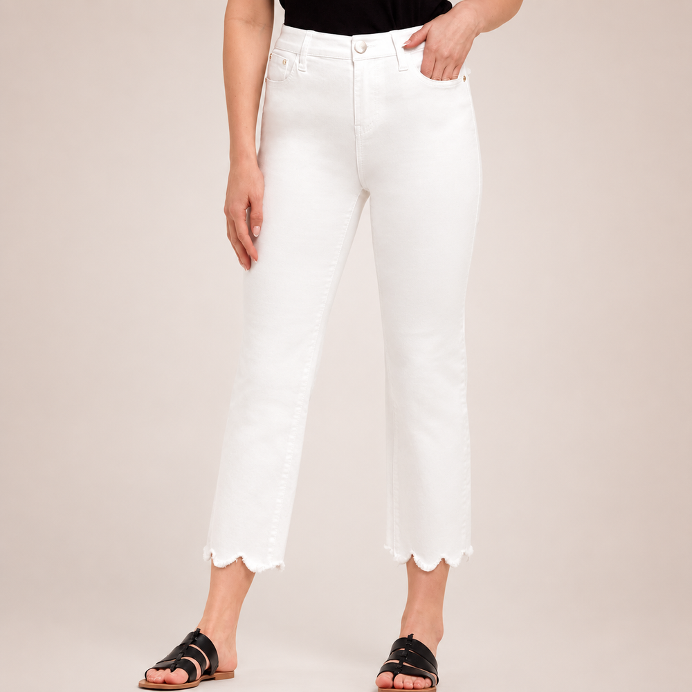 Person wearing white pants with a plain background