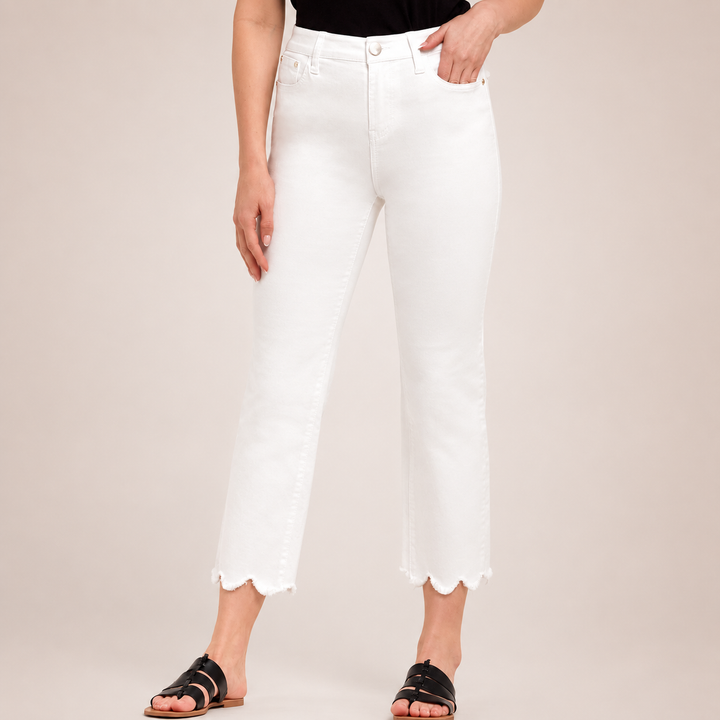 Person wearing white pants with a plain background