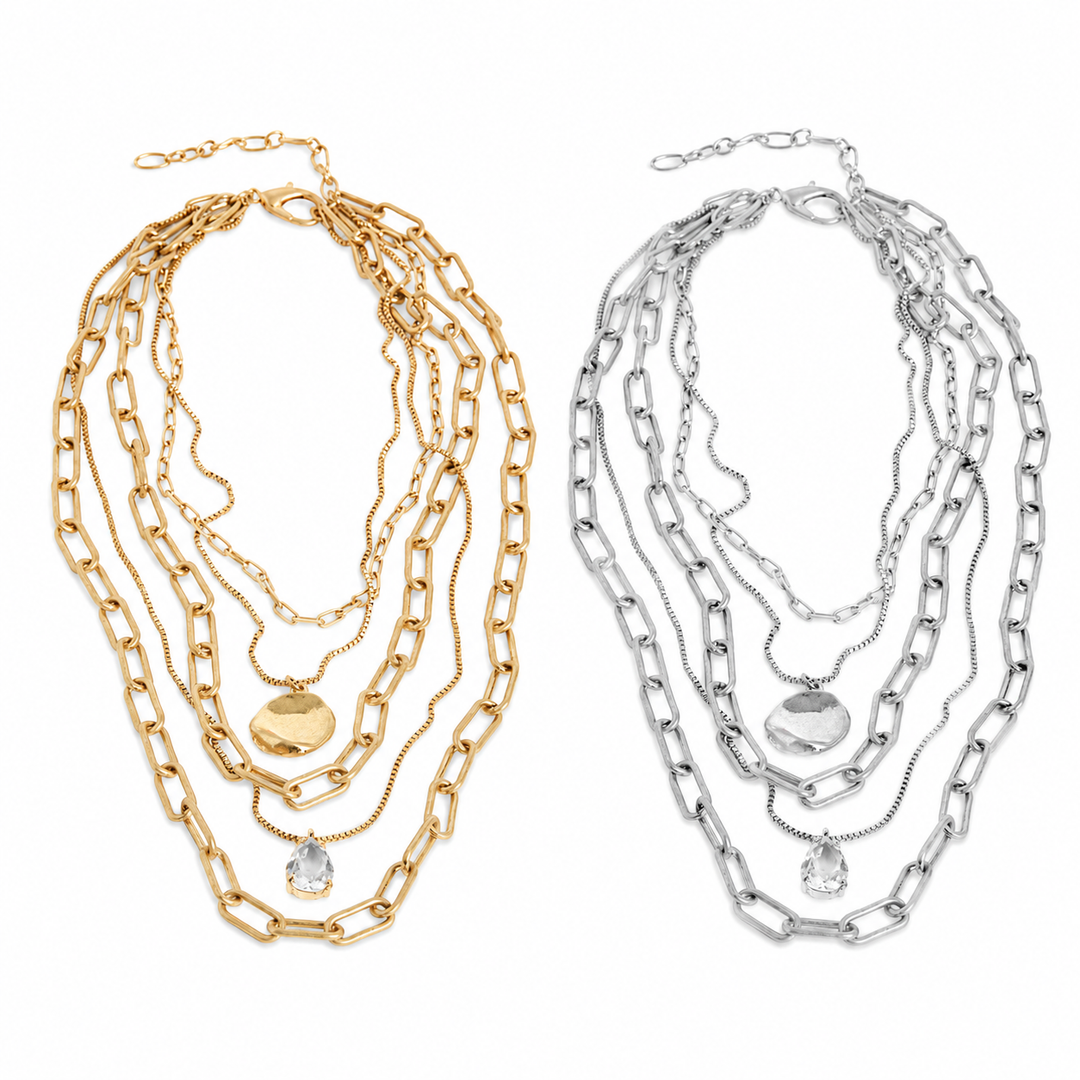 Two sets of layered chain necklaces, one gold and one silver, on a white background.