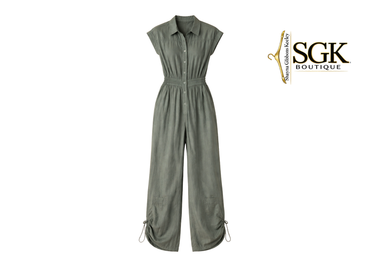 Green jumpsuit on a white background with SGK Boutique logo.