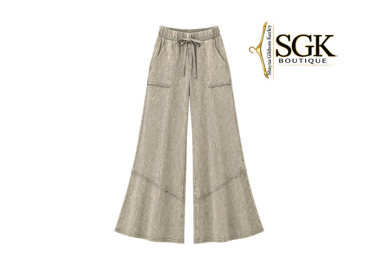 Beige wide-leg pants with an SGK Boutique logo on a white background