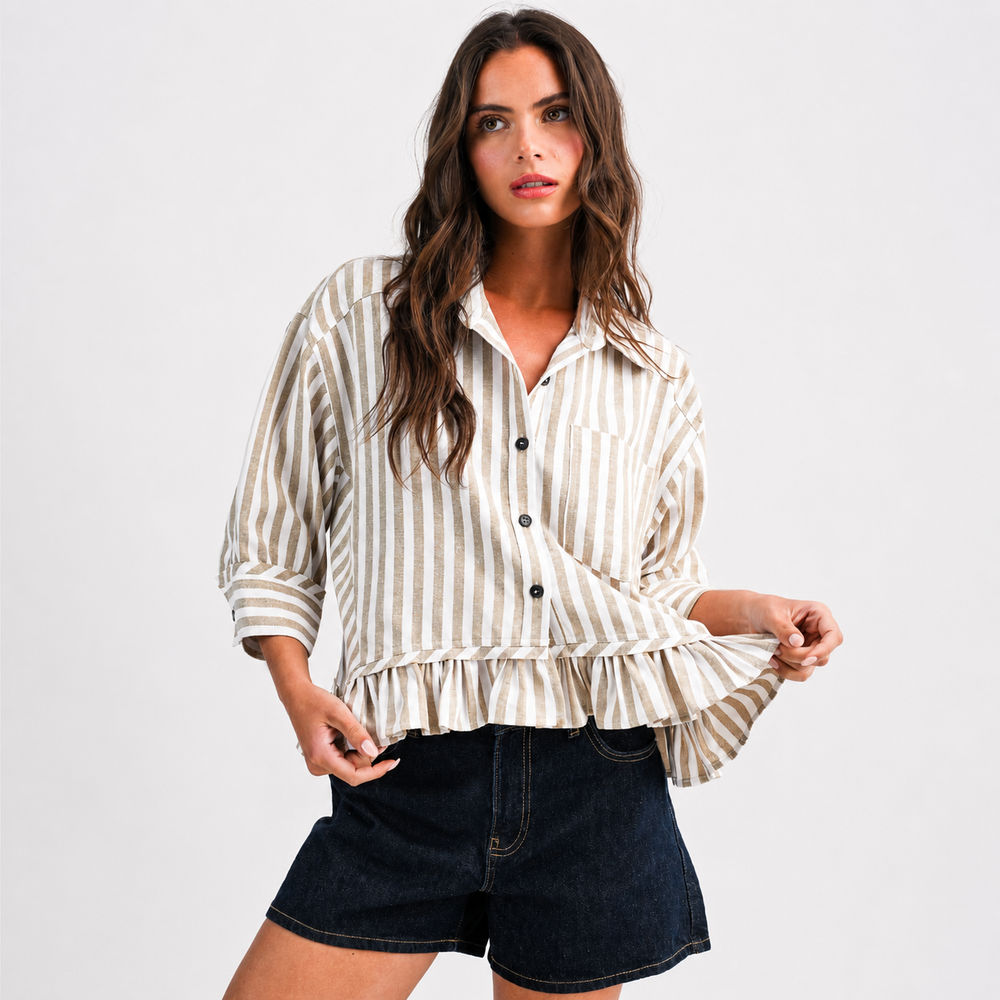 Woman wearing a striped shirt and denim shorts on a white background
