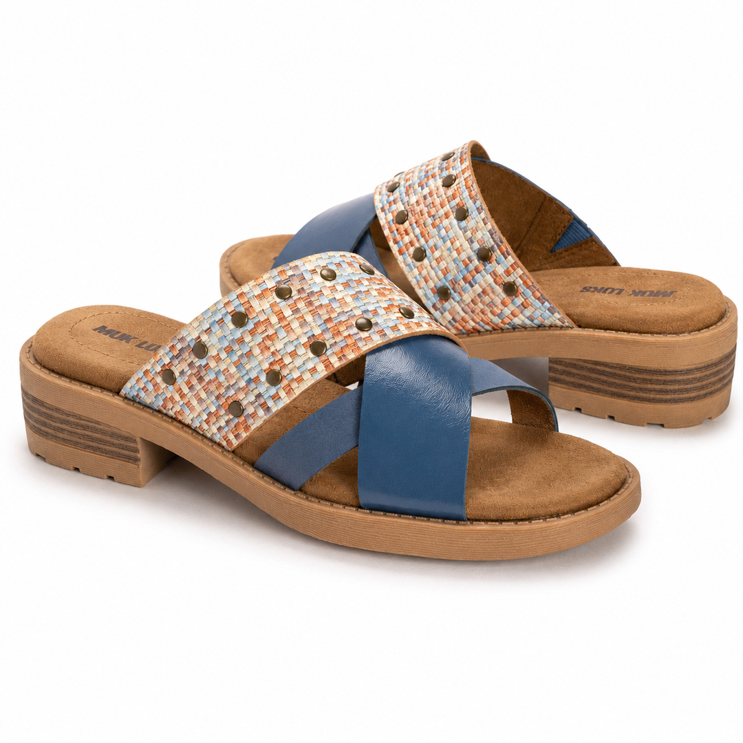 Pair of sandals with woven straps and brown sole on a white background