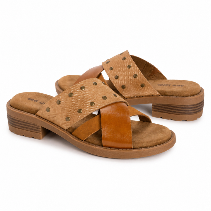 Pair of brown sandals with stud details on a white background