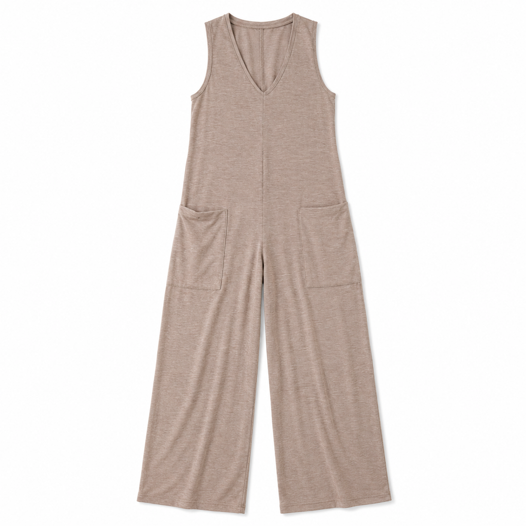 A sleeveless, wide-leg jumpsuit in a heathered taupe-beige color, featuring a V-neckline and two large patch pockets on the front, shown flat against a white background.