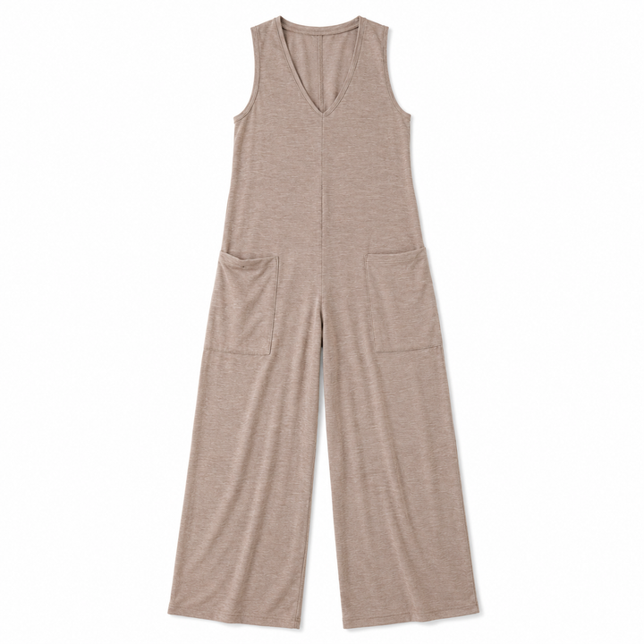 A sleeveless, wide-leg jumpsuit in a heathered taupe-beige color, featuring a V-neckline and two large patch pockets on the front, shown flat against a white background.