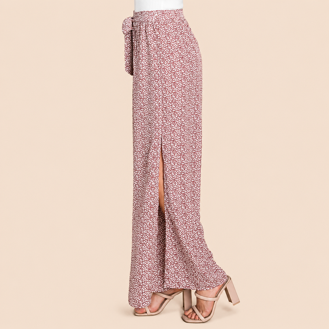 Floral patterned pants with a slit on a beige background