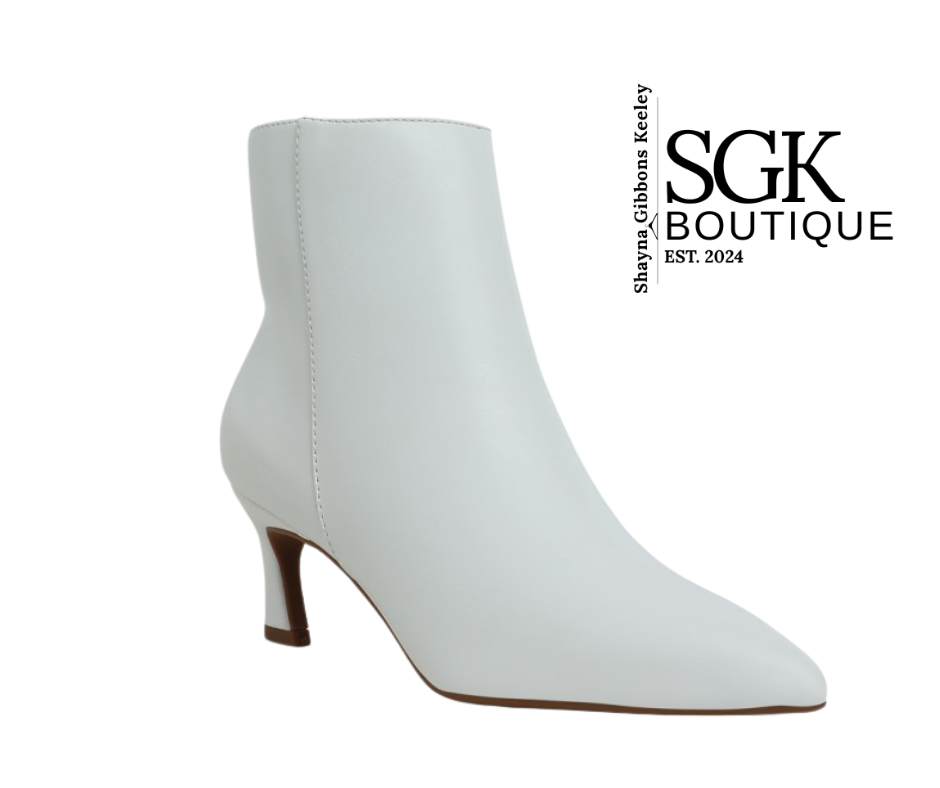 White ankle boot on a white background with SGK Boutique logo.